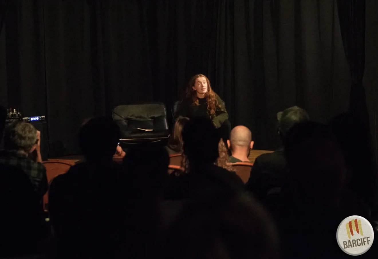 A seated moment from I Should Do Better on stage